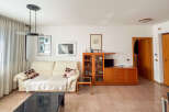 This inviting living room features a comfortable sofa, perfect for relaxing.