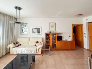 This inviting living room features a comfortable sofa, perfect for relaxing.