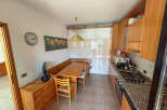 This charming kitchen offers a cozy dining area, perfect for enjoying meals.