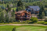 Nestled amidst lush greenery, this stunning property boasts a luxurious design with multiple levels and expansive decks.