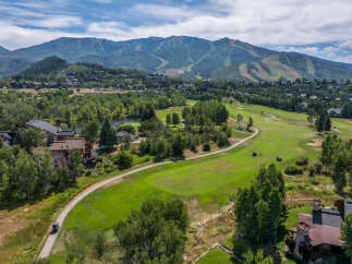 This stunning property boasts a picturesque golf course view, perfect for those who enjoy outdoor activities.