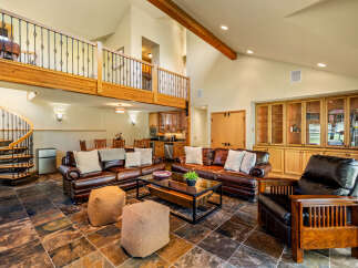 This stunning property boasts a spacious living area with a loft, perfect for entertaining or relaxing.