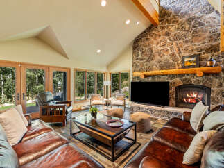 Experience the epitome of rustic luxury in this stunning living room.