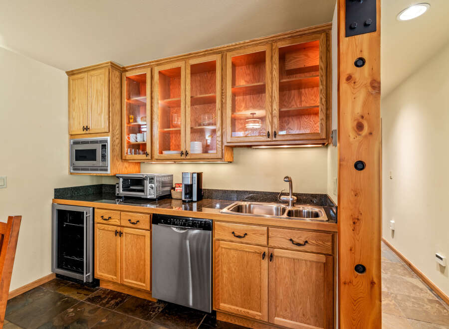 This stunning kitchen boasts custom cabinetry, perfect for storage and organization.