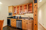This stunning kitchen boasts custom cabinetry, perfect for storage and organization.