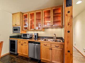 This stunning kitchen boasts custom cabinetry, perfect for storage and organization.