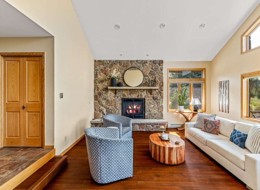 This stunning living room features a cozy stone fireplace, perfect for relaxing evenings.