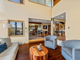 This stunning property boasts a spacious living area with high ceilings and abundant natural light.