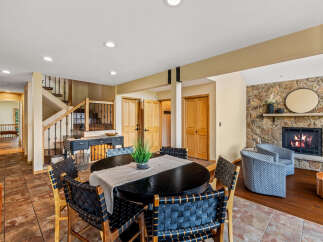 This stunning property boasts a spacious dining area, perfect for hosting gatherings.