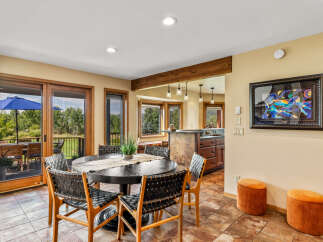 This stunning dining area boasts a modern aesthetic with a touch of rustic charm.