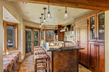 This stunning kitchen boasts a seamless blend of rustic charm and modern elegance.