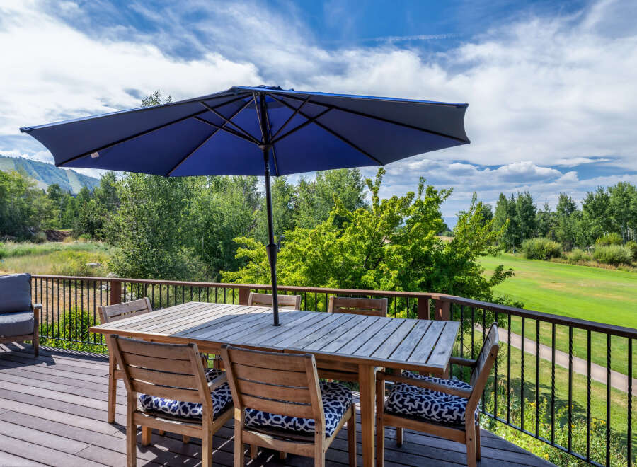 Enjoy breathtaking views from this stunning outdoor deck, perfect for entertaining or relaxing.
