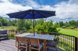 Enjoy breathtaking views from this stunning outdoor deck, perfect for entertaining or relaxing.