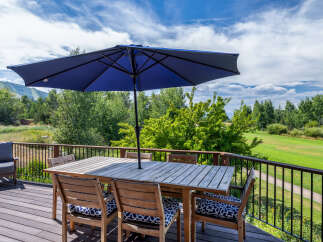 Enjoy breathtaking views from this stunning outdoor deck, perfect for entertaining or relaxing.