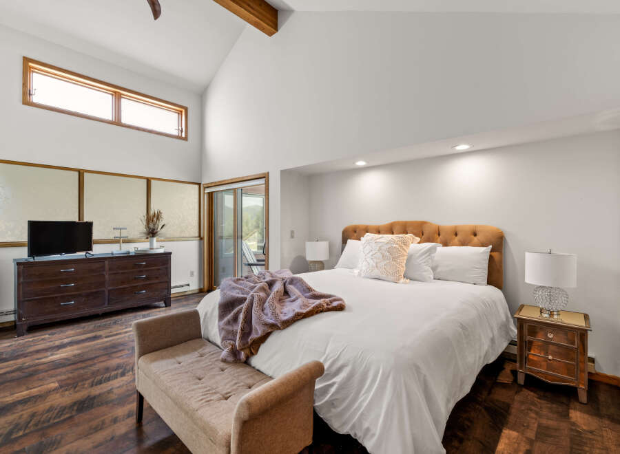 Experience luxury in this stunning bedroom featuring a plush bed, perfect for relaxation.