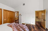 Step into this inviting bedroom, featuring warm wood flooring and ample natural light.