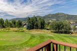 Enjoy stunning views of the golf course and surrounding mountains from this beautiful property.