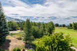 Enjoy breathtaking views of the mountains and lush greenery from this stunning property.