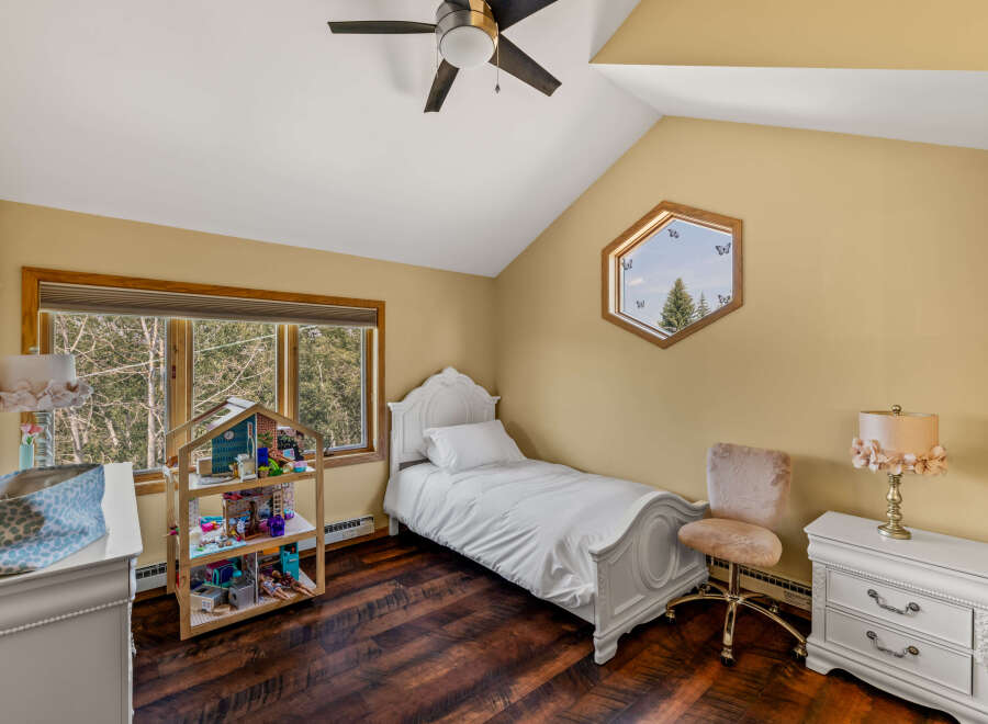 This charming bedroom features a cozy single bed, perfect for a child or guest.