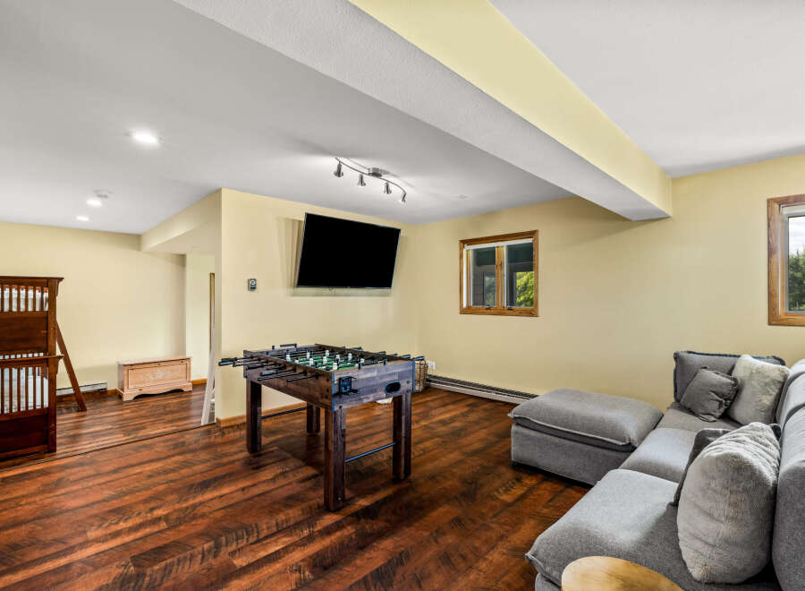 This stunning property boasts a spacious game room, perfect for entertaining and relaxation.