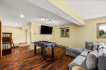 This stunning property boasts a spacious game room, perfect for entertaining and relaxation.