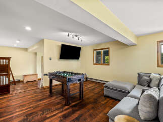 This stunning property boasts a spacious game room, perfect for entertaining and relaxation.