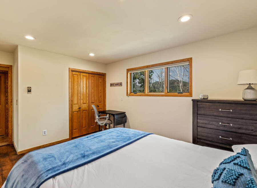 This cozy bedroom offers a tranquil retreat with its inviting ambiance and thoughtful design.
