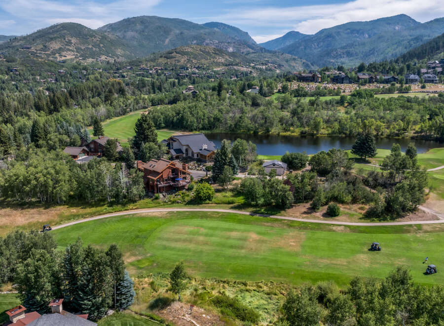 Discover luxury living in this stunning property nestled amidst a picturesque golf course and serene lake.