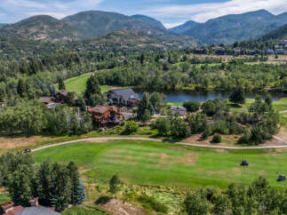 Discover luxury living in this stunning property nestled amidst a picturesque golf course and serene lake.
