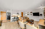 This cozy living space features a comfortable leather sofa, perfect for relaxing after a day of exploring.