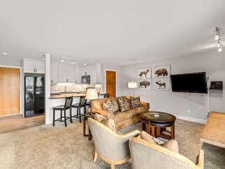 This cozy living space features a comfortable leather sofa, perfect for relaxing after a day of exploring.
