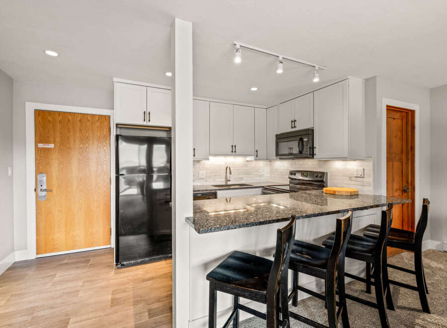This stunning kitchen boasts modern design and functionality.