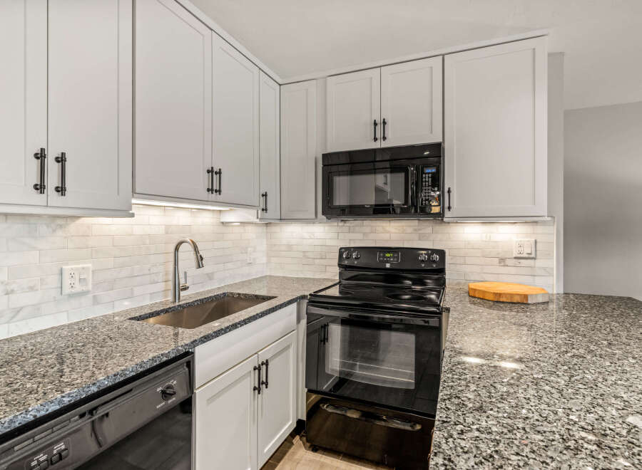 This stunning kitchen boasts modern design and functionality.