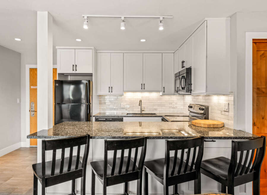 This stunning kitchen boasts modern design and functionality.