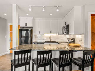This stunning kitchen boasts modern design and functionality.