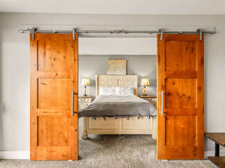 Step into a world of rustic elegance with this stunning bedroom.