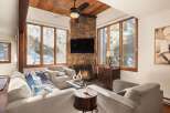Step into luxury with this stunning living room, featuring a cozy fireplace and a sleek mounted TV.