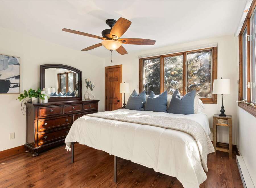 Step into a cozy bedroom retreat with this inviting space.