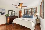 Step into a cozy bedroom retreat with this inviting space.