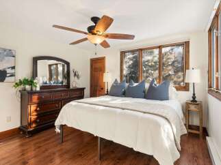 Step into a cozy bedroom retreat with this inviting space.