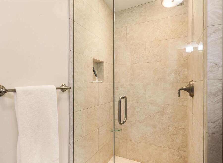 Step into a luxurious bathroom featuring a modern glass-enclosed shower.
