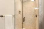 Step into a luxurious bathroom featuring a modern glass-enclosed shower.