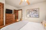 This cozy bedroom features a comfortable bed with a soft, inviting comforter and a stylish, decorative pillow.