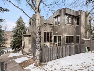 This stunning property boasts a modern design with a unique exterior.