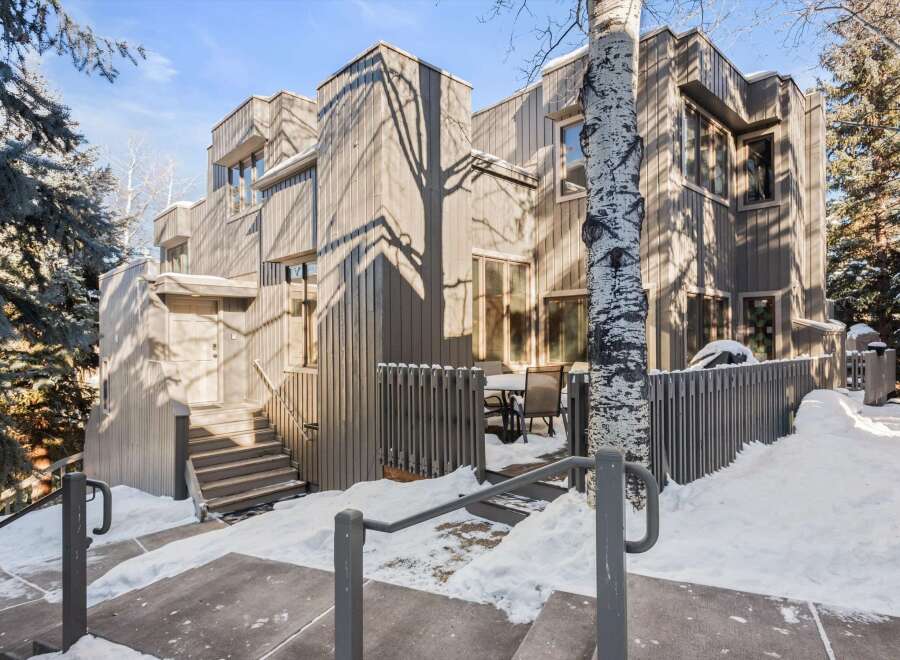 This stunning property boasts a modern design with a touch of nature, featuring a beautiful exterior and a serene outdoor space.