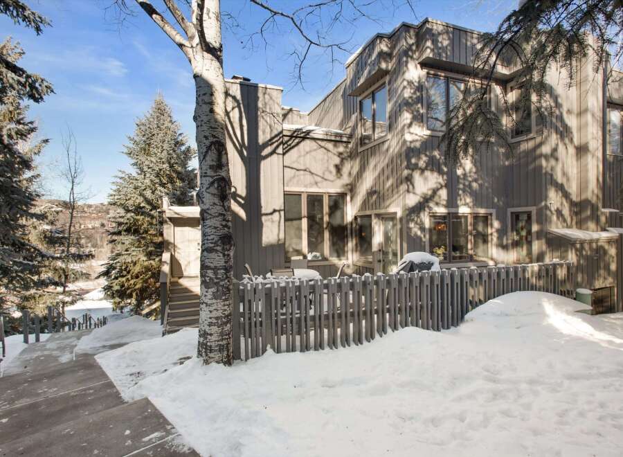 Discover this stunning property featuring a modern design and a serene winter landscape.