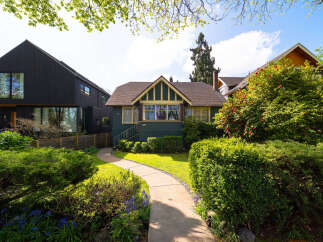 This charming home boasts a classic design with a welcoming facade.