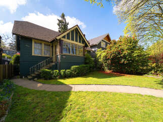 This charming home boasts a classic design with a welcoming facade.