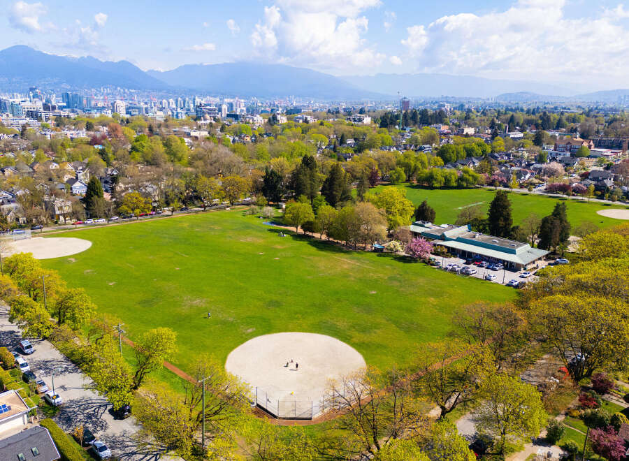 This stunning aerial view showcases a vibrant green park, perfect for outdoor activities and recreation.