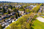 This stunning aerial view showcases a beautiful neighborhood with lush greenery and well-maintained homes.